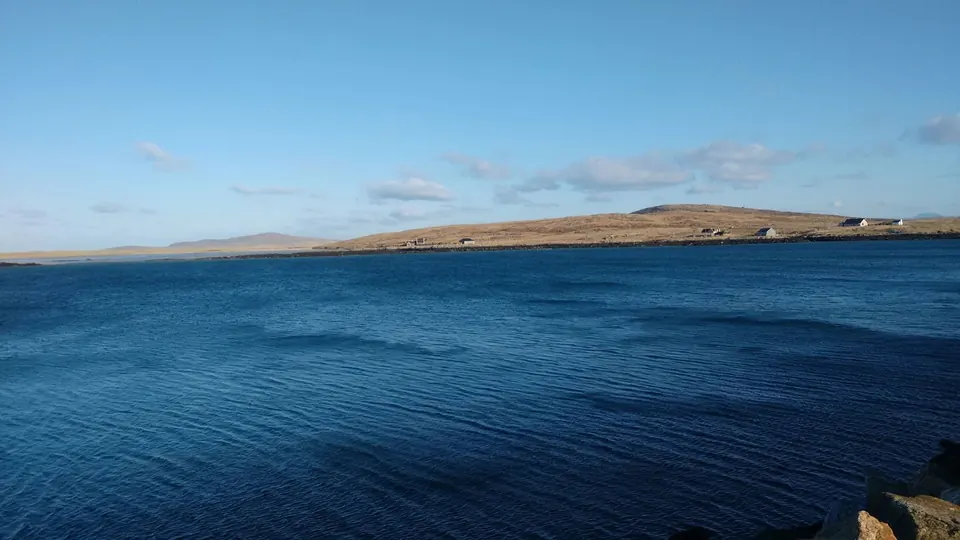 The Sound of Harris on a bright day, deep blue water with an island beyond